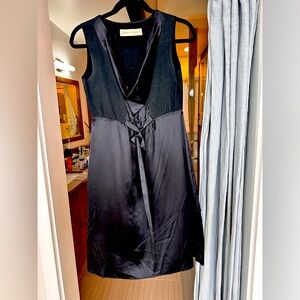 Edgy, sleeveless, black and silk cocktail dress by Graham & Spencer.